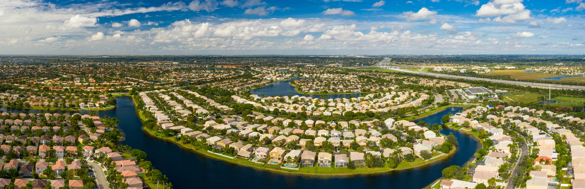 Aerial view of a master-planned community with lakes and irrigated common areas